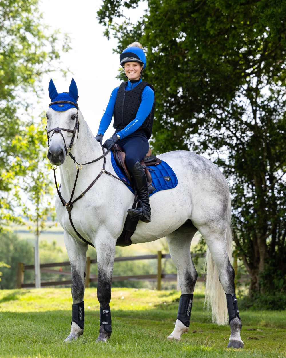 Benetton Coloured LeMieux Loire Close Contact Square On A Riding Arena Background