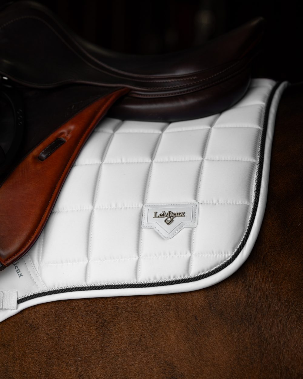 White Coloured LeMieux Loire Close Contact Square On A Stable Background