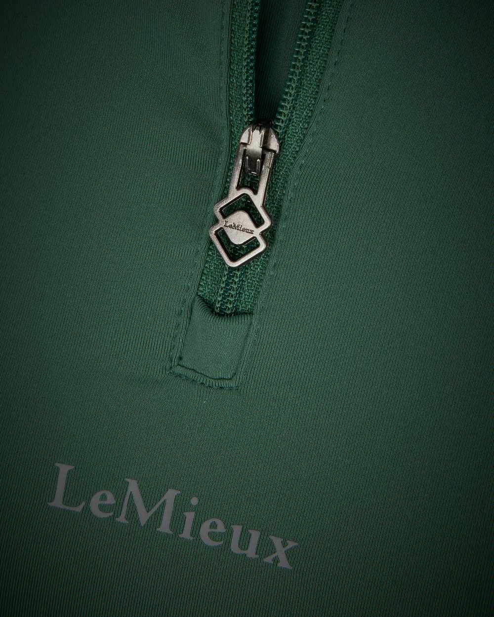 Hunter Green coloured LeMieux Mia Mesh Short Sleeve Base Layer on white background