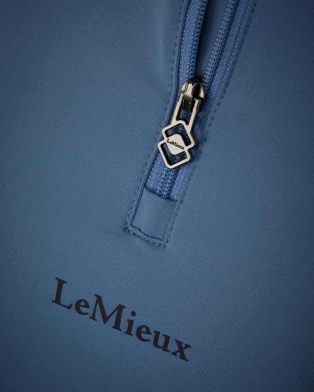 Ice Blue coloured LeMieux Mia Mesh Short Sleeve Base Layer on white background