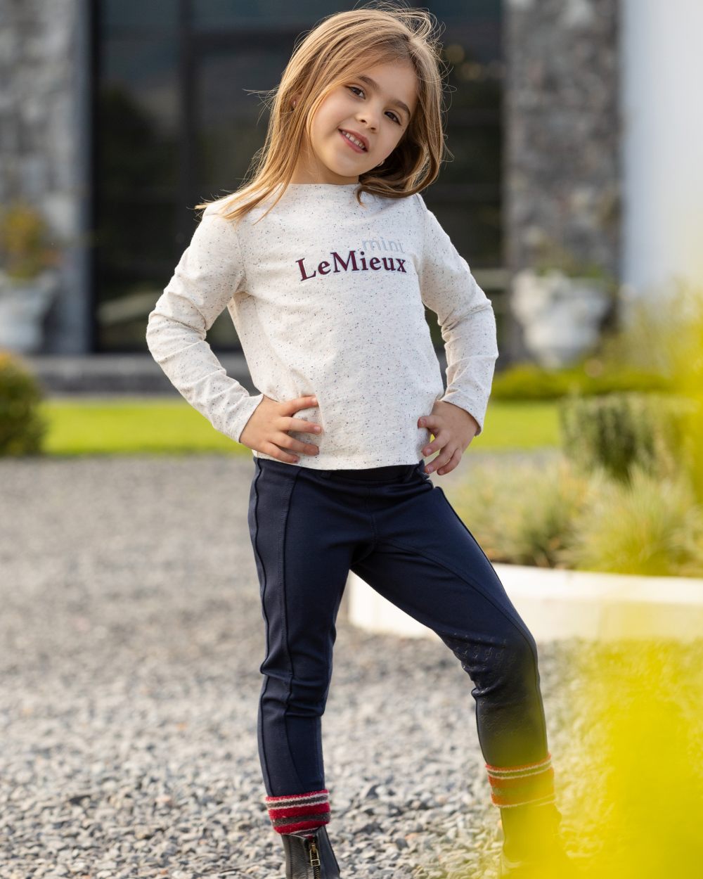 Ecru Nep Coloured LeMieux Mini Jessie Long Sleeve Top On A Street Background