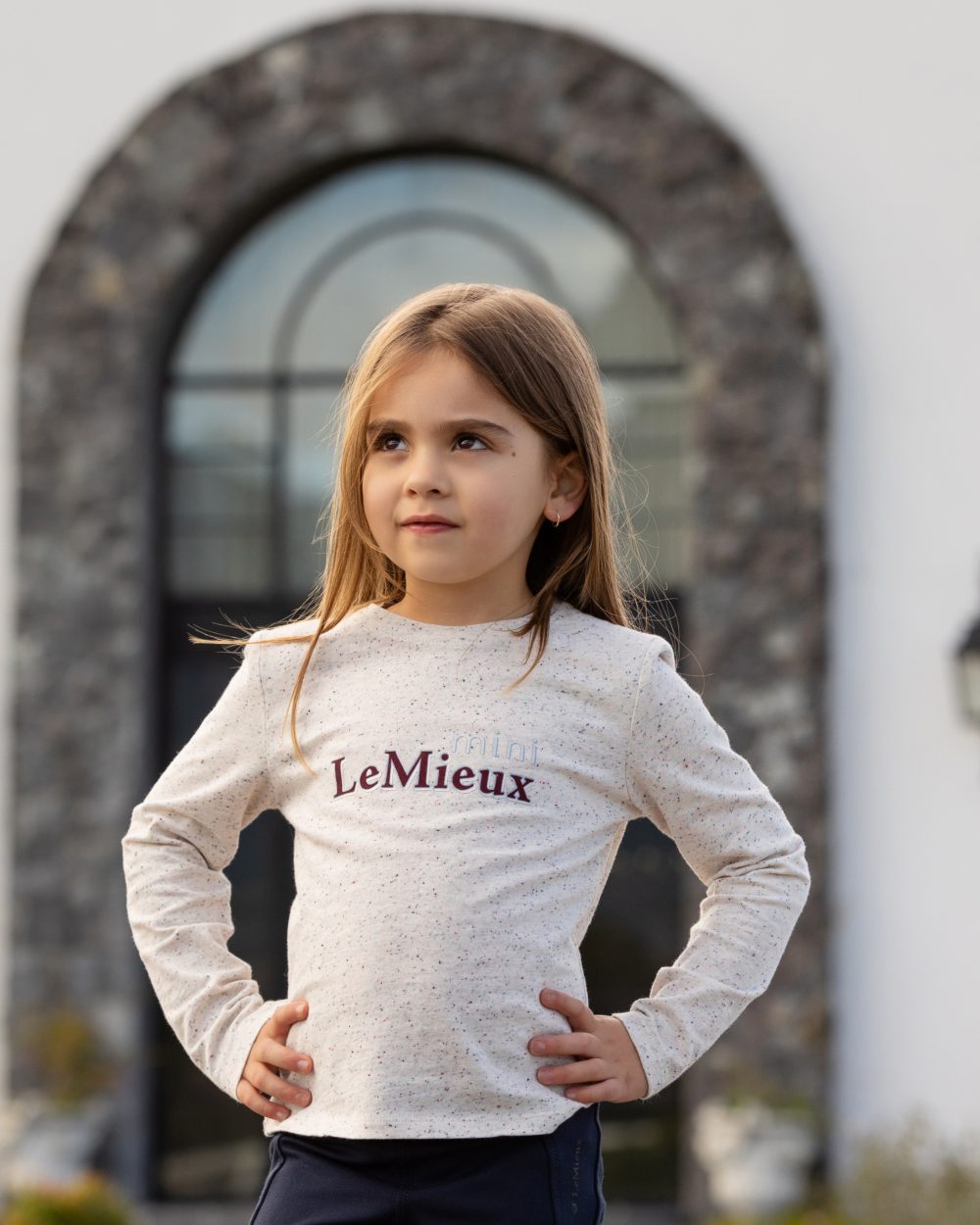 Ecru Nep Coloured LeMieux Mini Jessie Long Sleeve Top On A Street Background