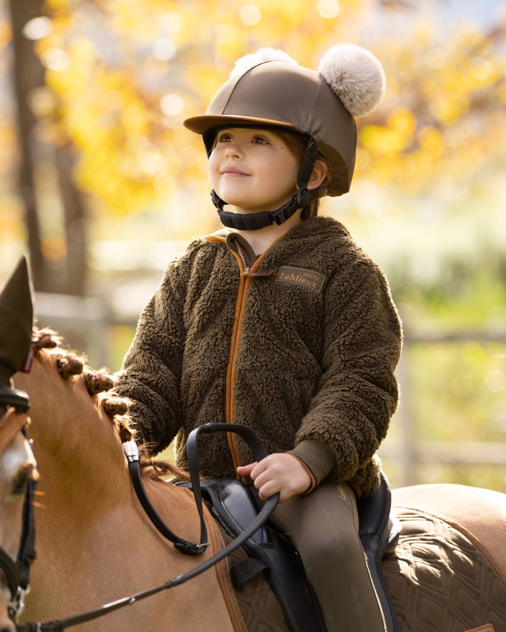 Alpine Coloured LeMieux Mini Teagan Fleece Jacket On A Outer Yard Background