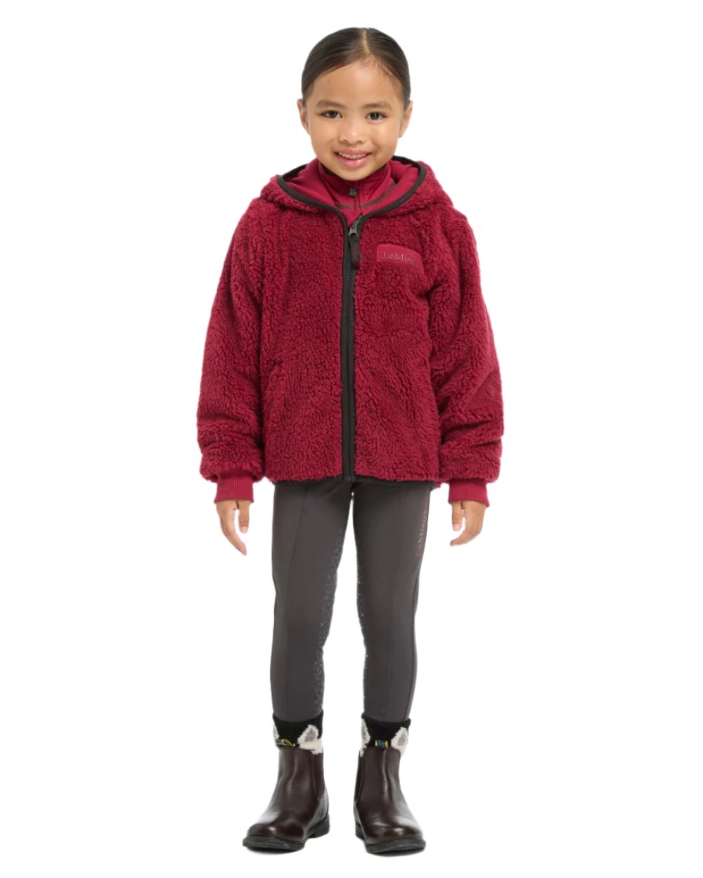 Ember Coloured LeMieux Mini Teagan Fleece Jacket On A White Background