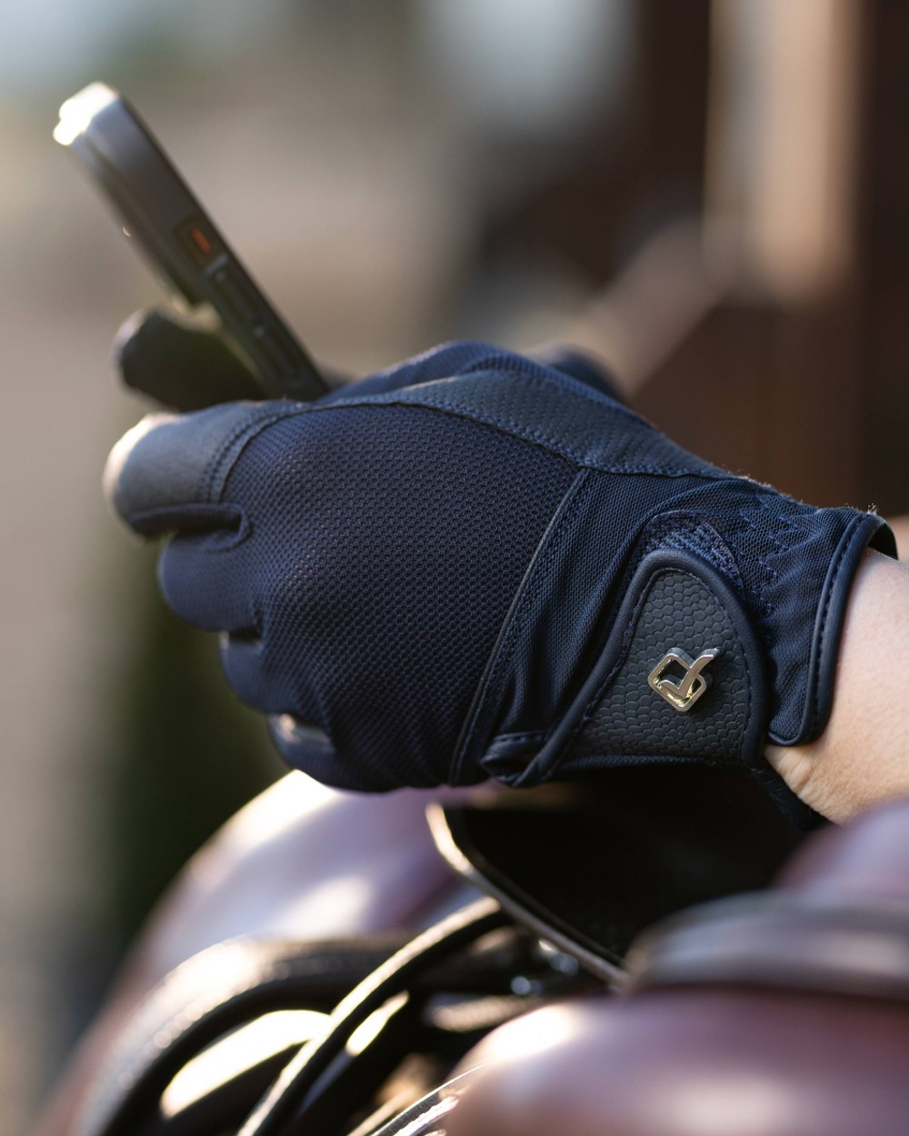Navy coloured LeMieux Pro Mesh Gloves on grey background