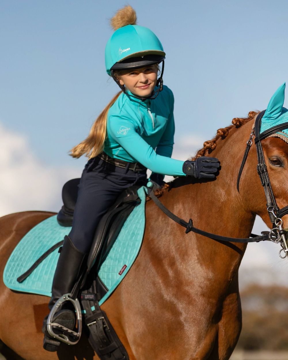 Azure coloured LeMieux Suede Close Contact Squares on sky background