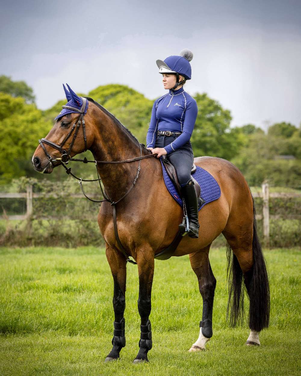 Ink Blue coloured LeMieux Suede Close Contact Squares on field background