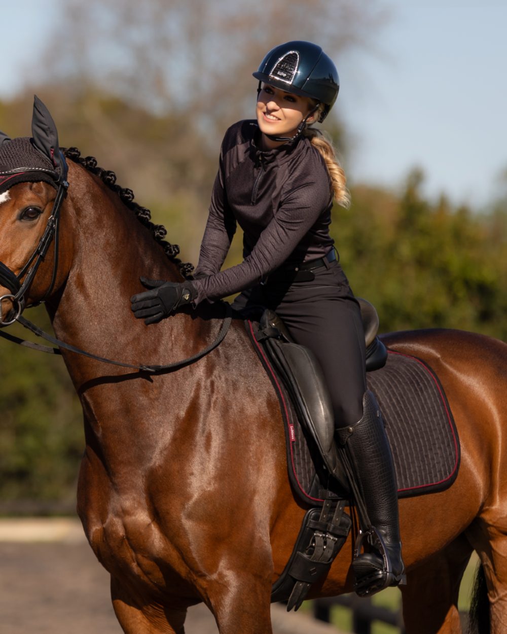Cinder Coloured LeMieux Suede Dressage Square On A blurry Background