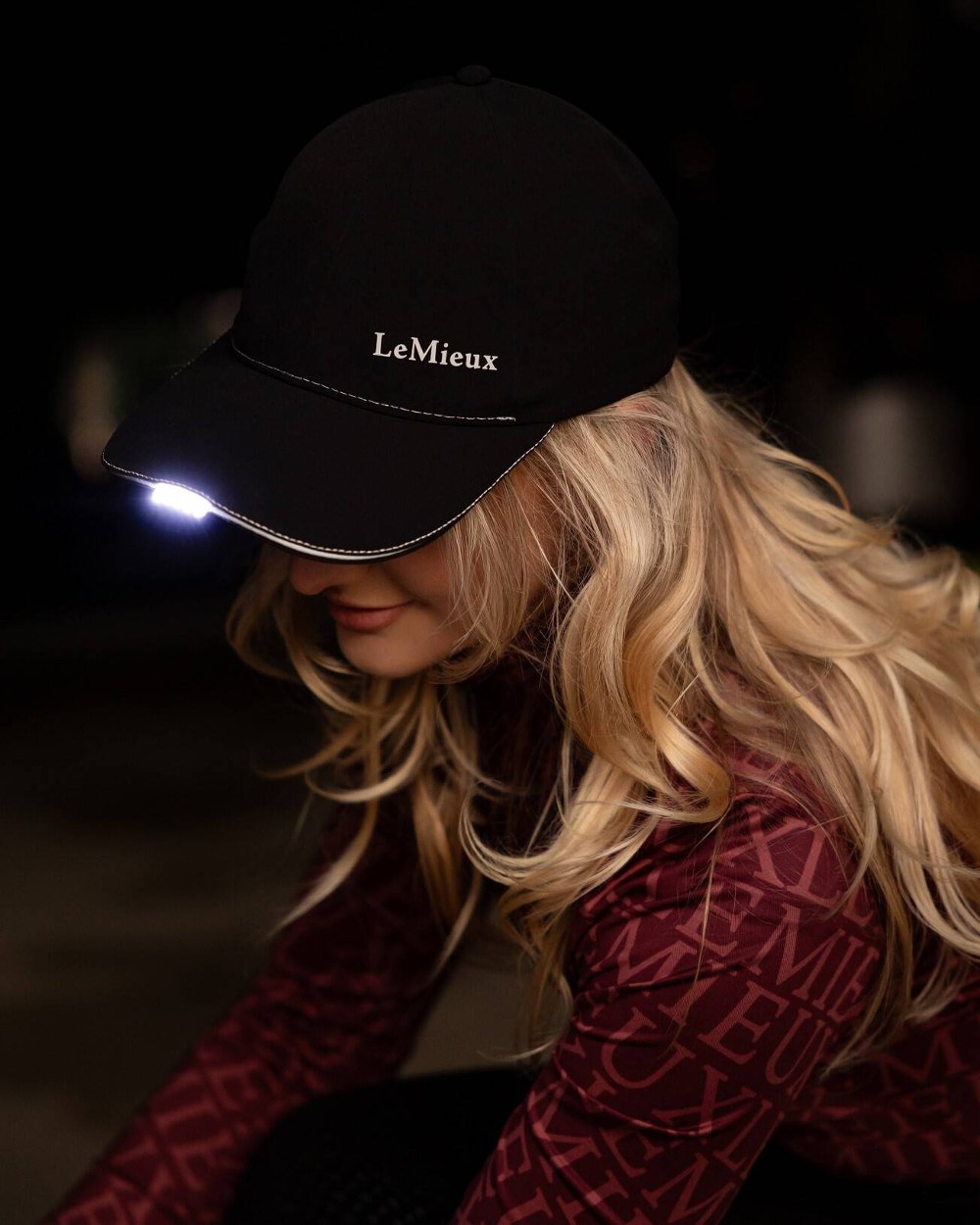 Black coloured LeMieux Torch Cap on black background