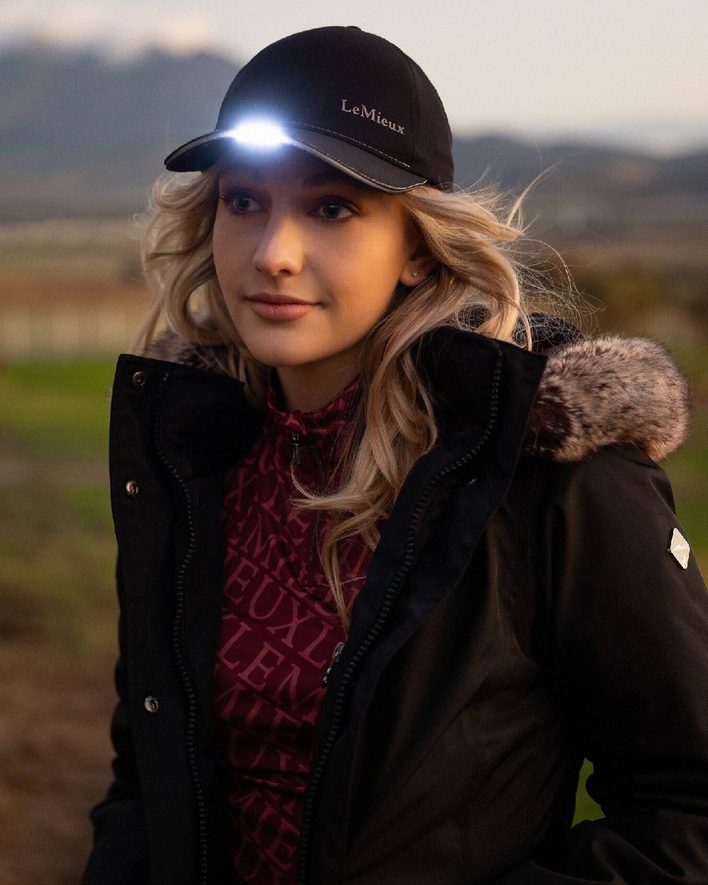 Black coloured LeMieux Torch Cap on blurry background