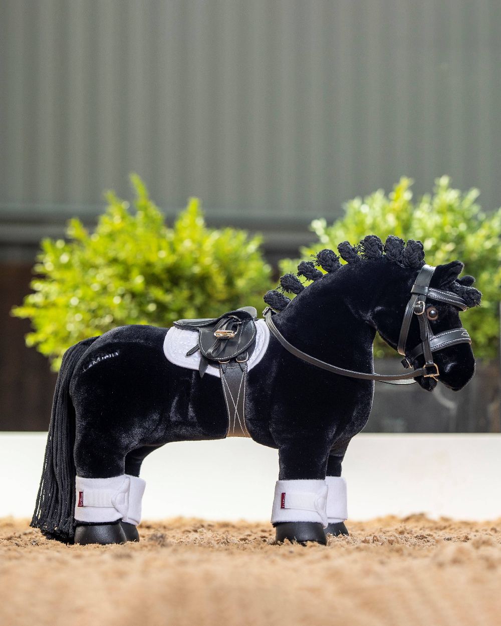 White coloured LeMieux Toy Pony Bandages on blurred pen background