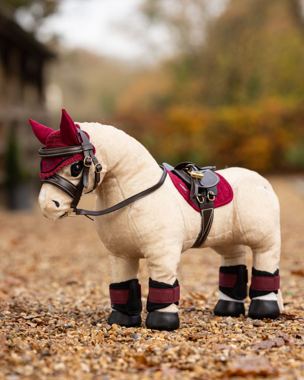 Ember Coloured LeMieux Toy Pony Grafter Boots On A Outer Yard Background