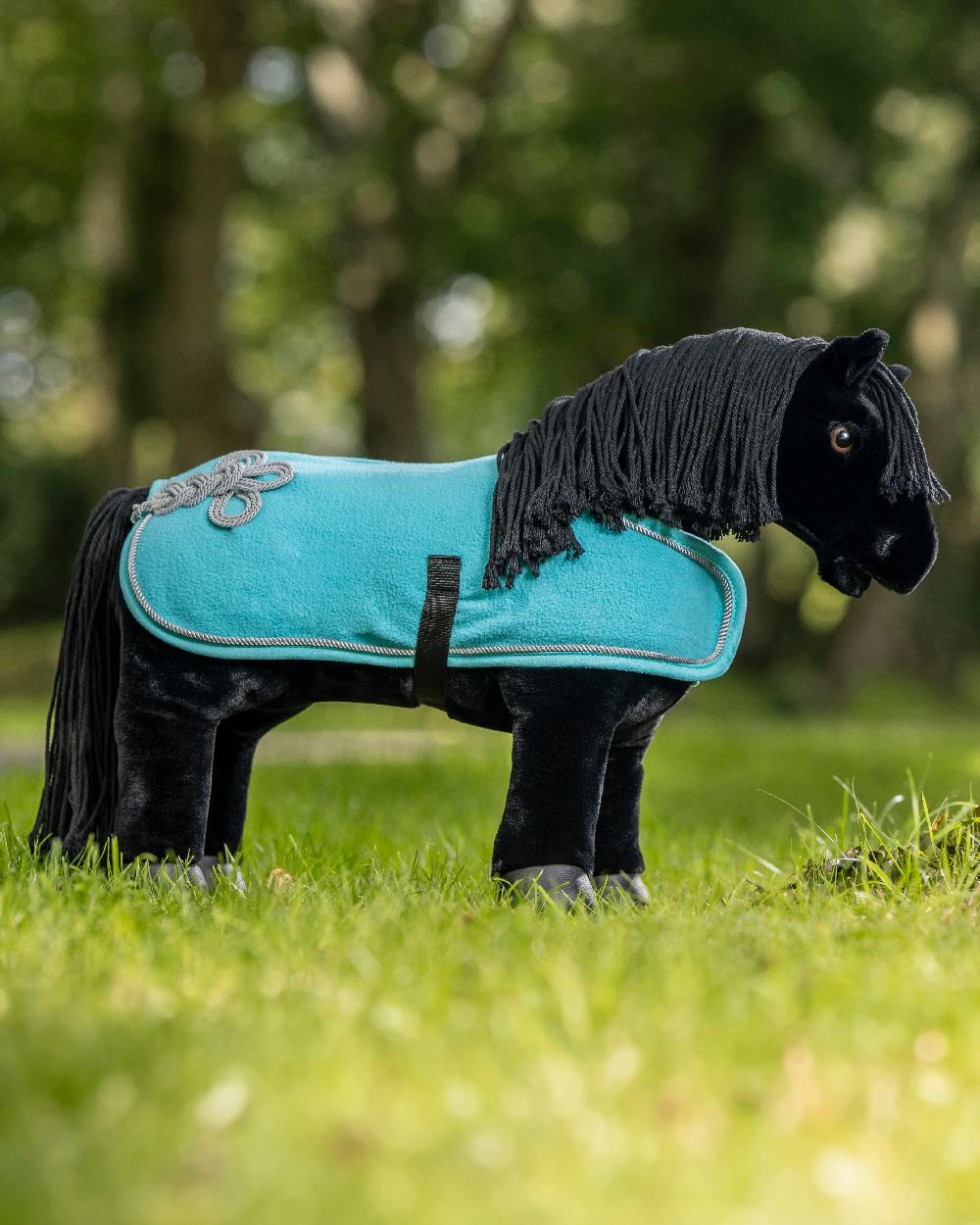 Azure coloured LeMieux Toy Pony Rug on green background