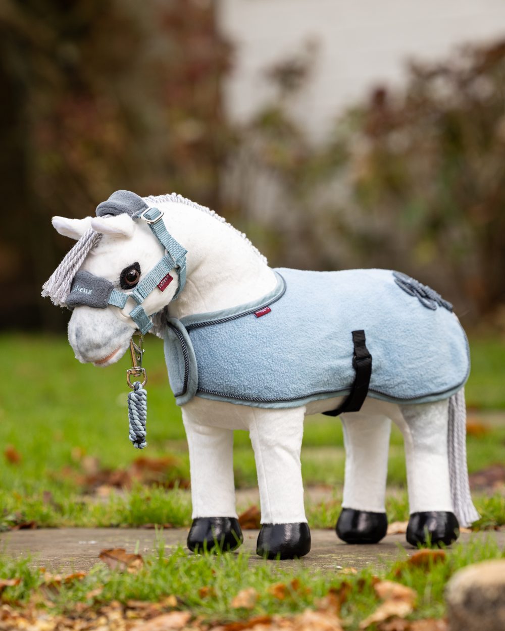 Glacier Coloured LeMieux Toy Pony Rug On A Outer Yard Background