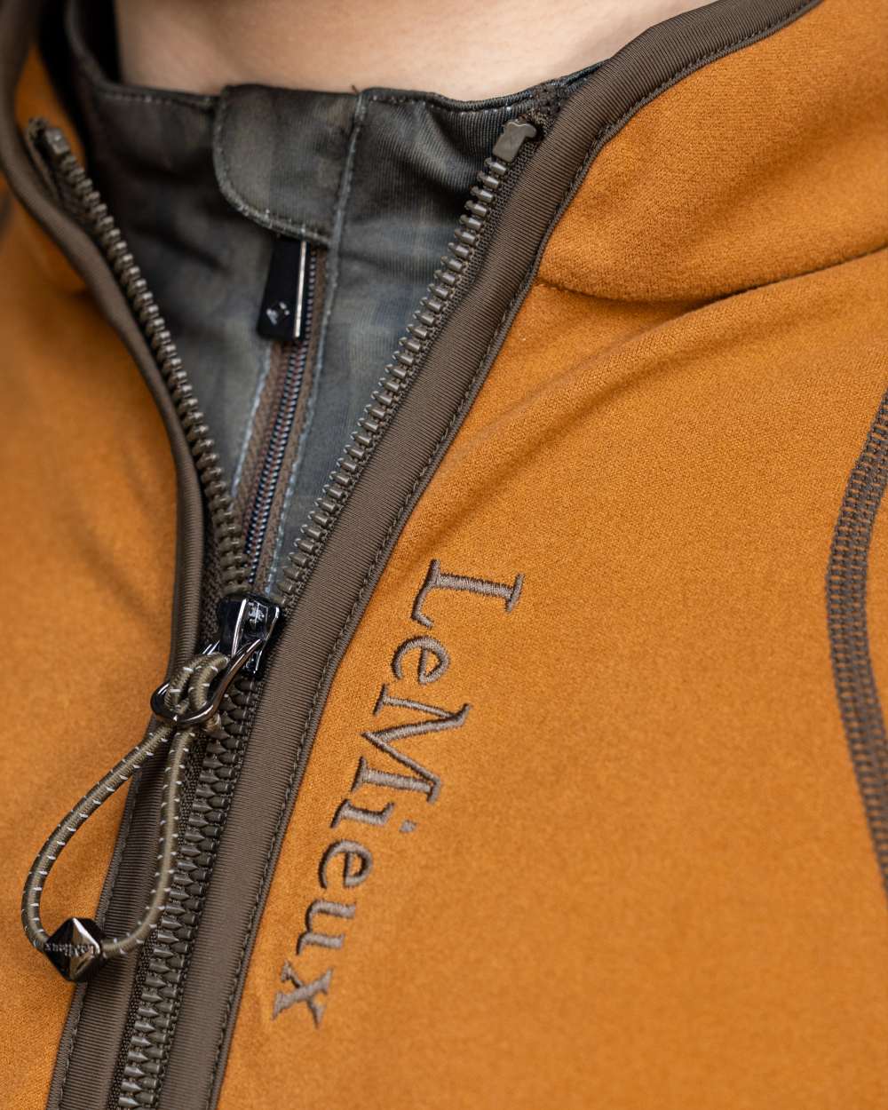 Ginger Coloured LeMieux Young Rider Felicity Fleece Zip Through Jacket On A White Background