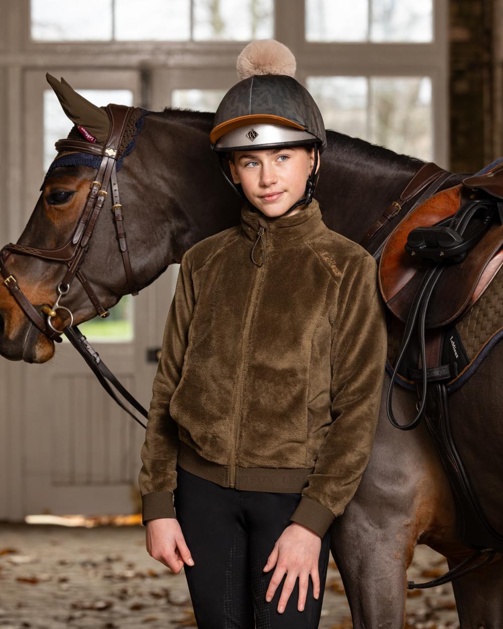 Alpine Coloured LeMieux Young Rider Libby Fleece Jacket On A Stable Background