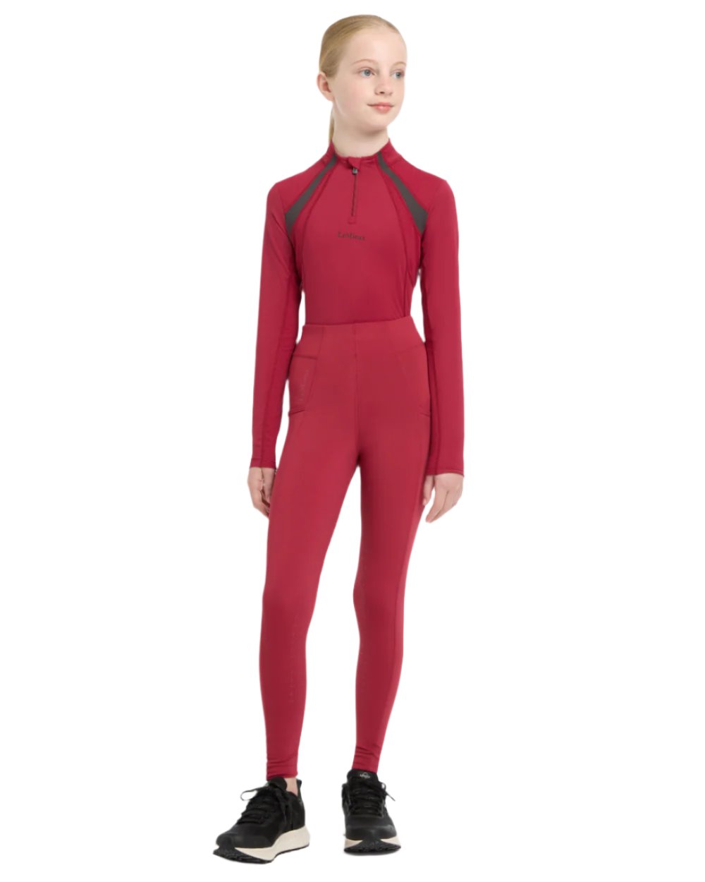 Ember Coloured LeMieux Young Rider Mia Mesh Base Layer On A White Background