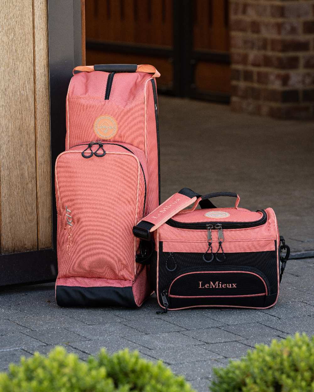 Apricot coloured LeMieux ProKit Lite Grooming Bag on blurry background