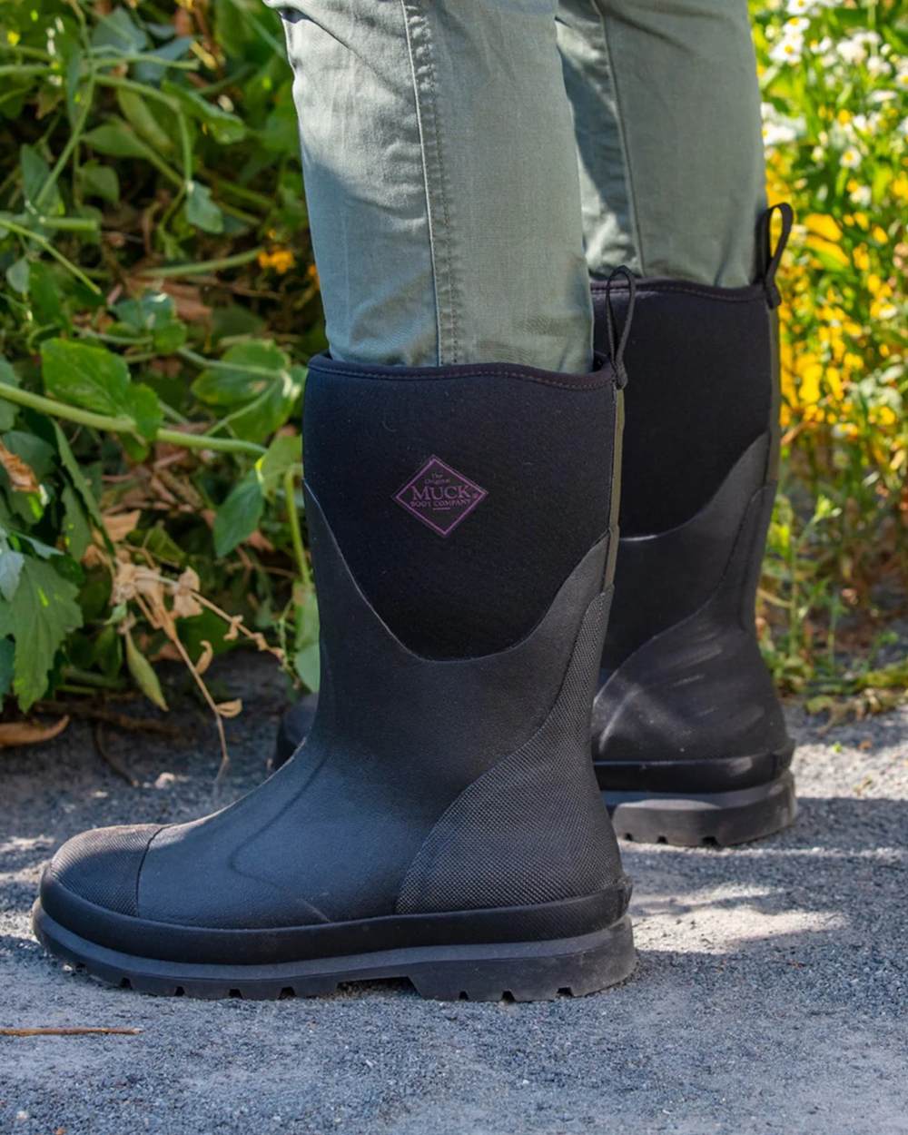 Black Coloured Muck Boots Womens Chore Classic Mid Wellingtons On A Street Background