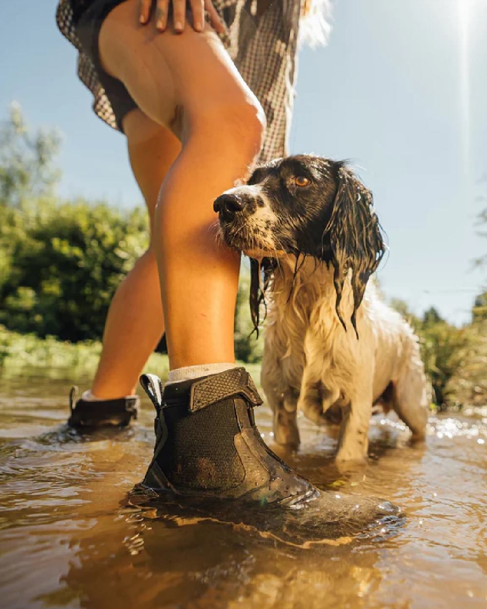 Black Coloured Muck Boots Ladies Apex Zip Mid Boots On A Forest Background