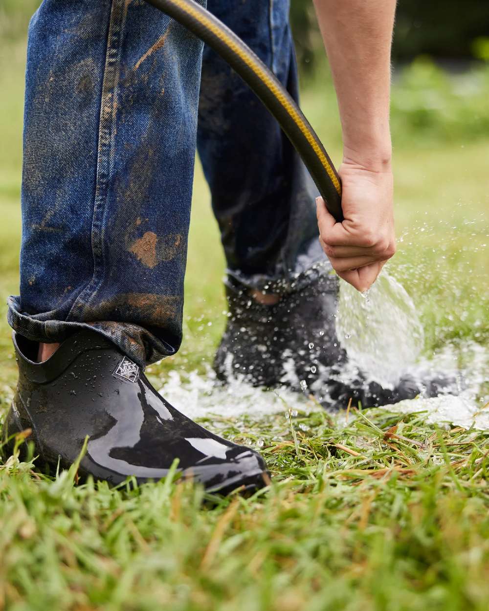 Black Coloured Muck Boots Mens Muckster Lite Ankle Boots On A Garden Background