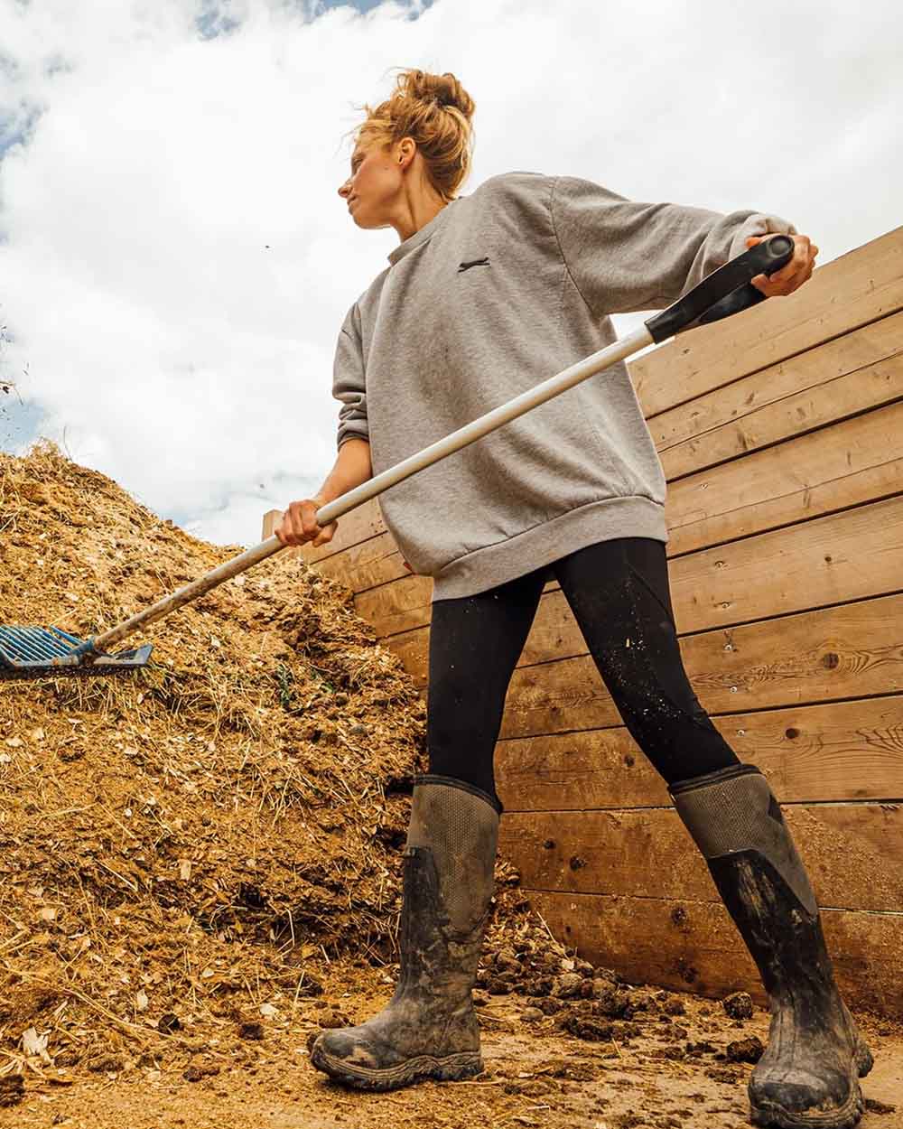 Black Grey coloured Muck Boots Womens Artic Sport II Tall Wellingtons on Compost background