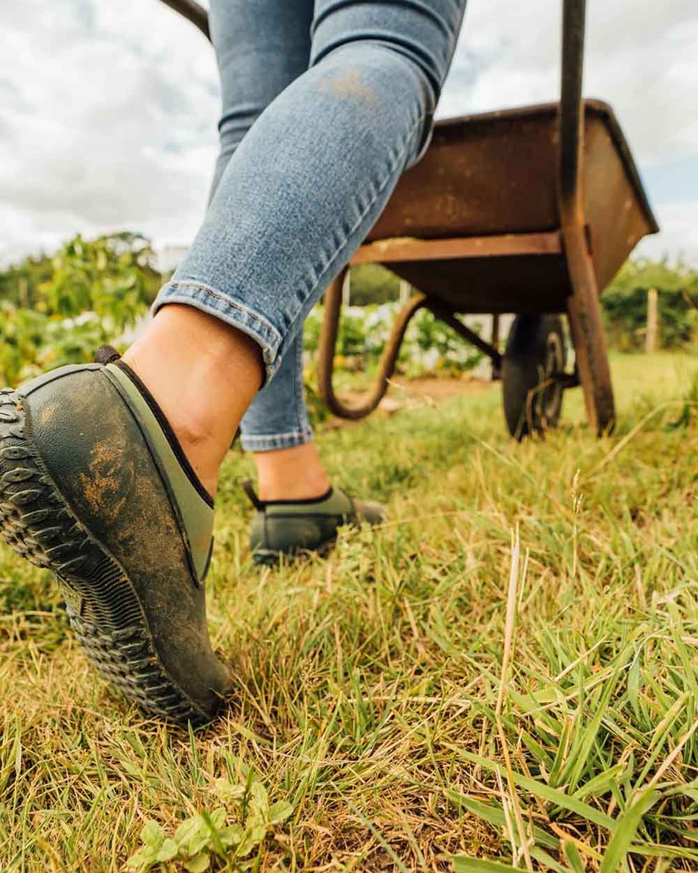 Green coloured Muck Boots Womens RHS Muckster II Low Shoes on Grassy background