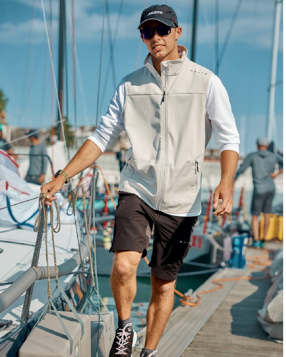 Platinum Coloured Musto Evo Crew Softshell Vest on Boat Background