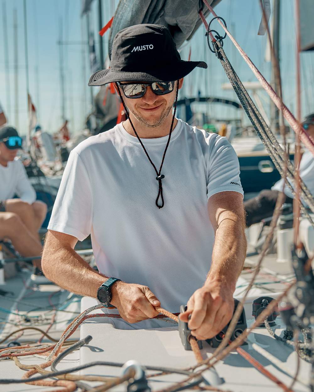 Black Coloured Musto Fast Dry Brimmed Hat on Blurry Background