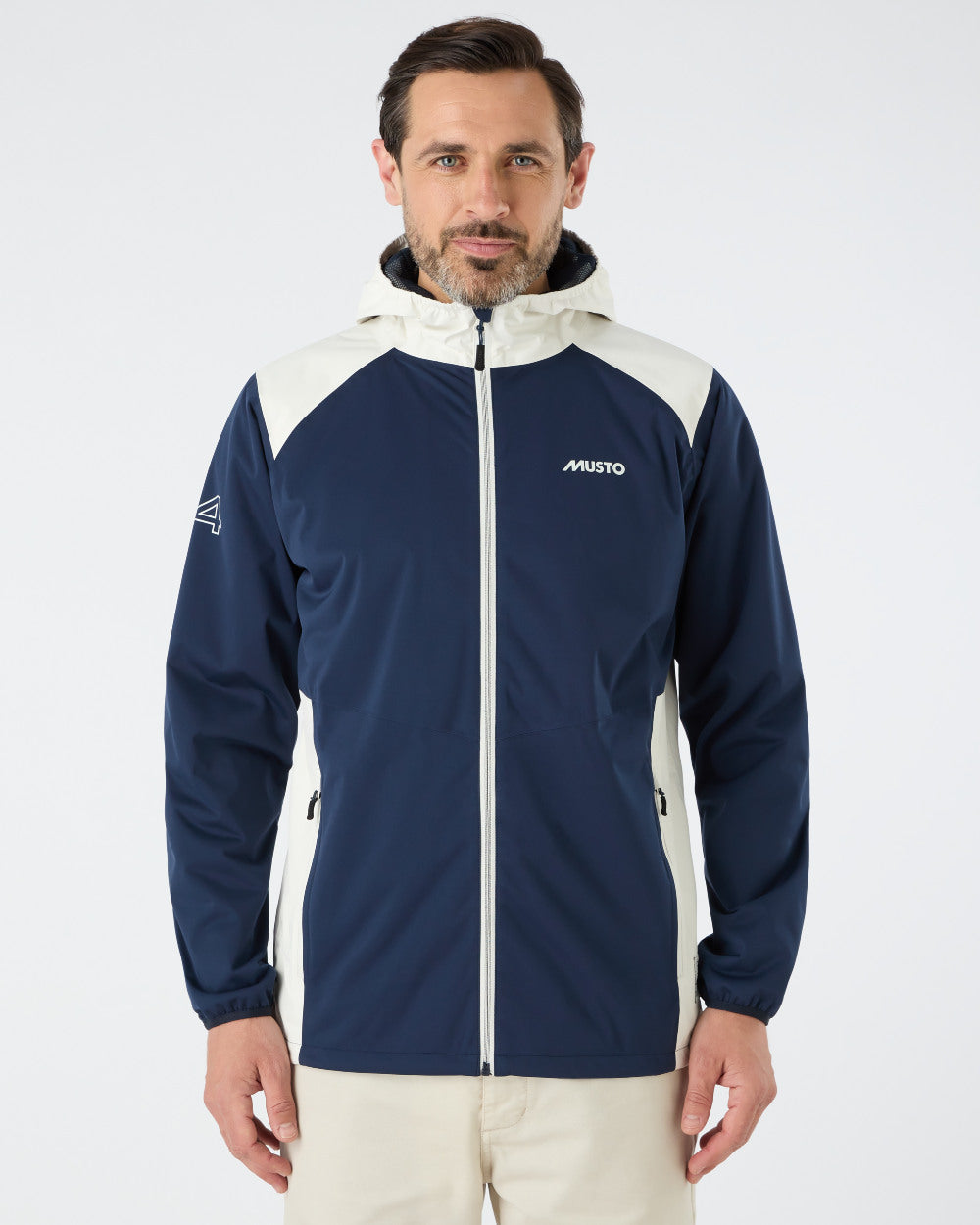 Navy/Asw Coloured Musto Mens 64 Active Waterproof Jacket On A Grey Background 
