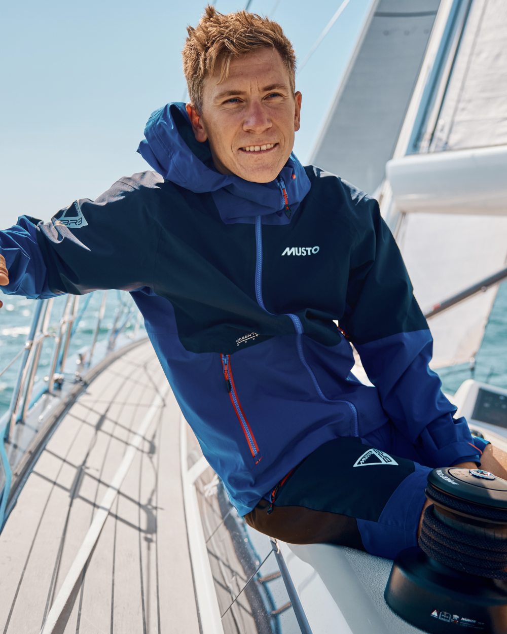 Mazarine Blue Coloured Musto Mens Br3 Sport Jacket on Sea Background