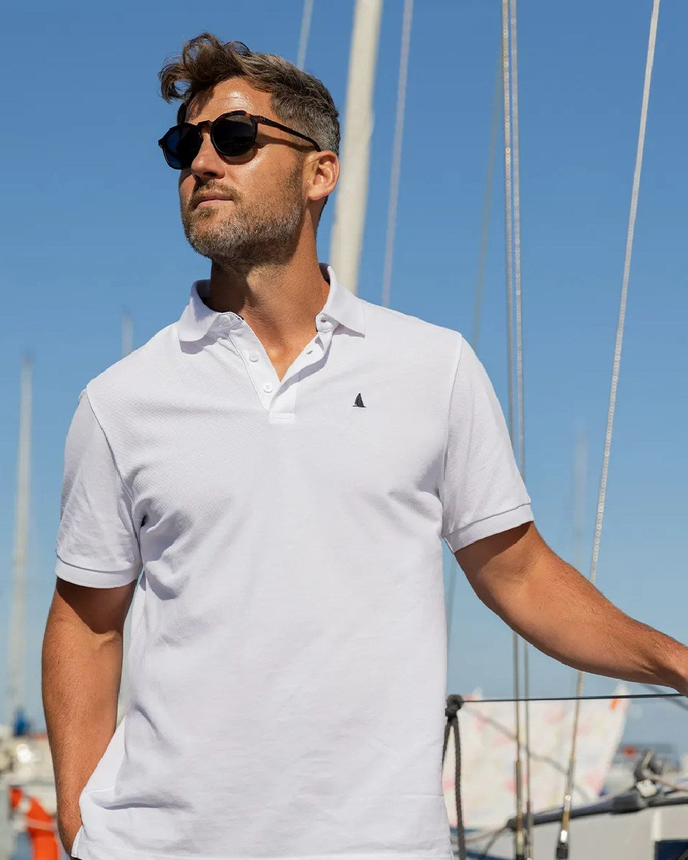 White Coloured Musto Mens Original Short Sleeve Polo on Sky Background