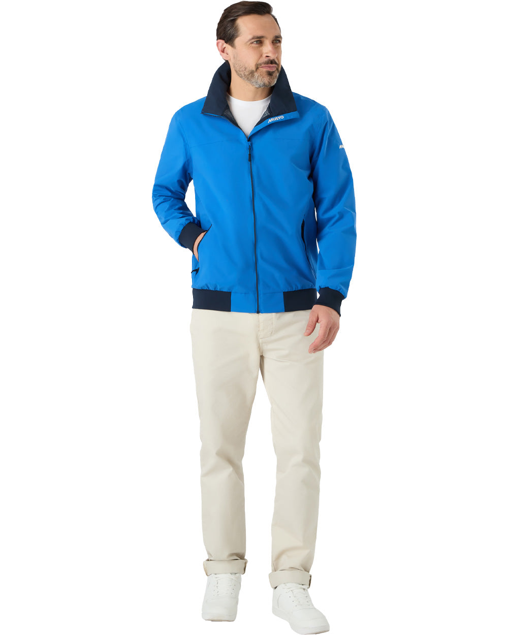 Aruba Blue coloured Musto Snug Blouson Jacket on White background