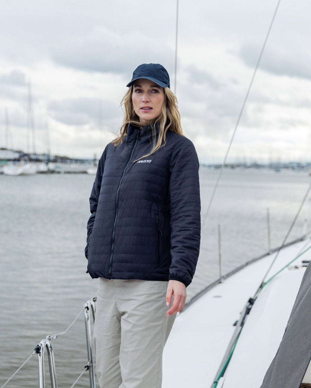 True Navy Coloured Musto Womens Solent Primaloft Insulator on Beach Background