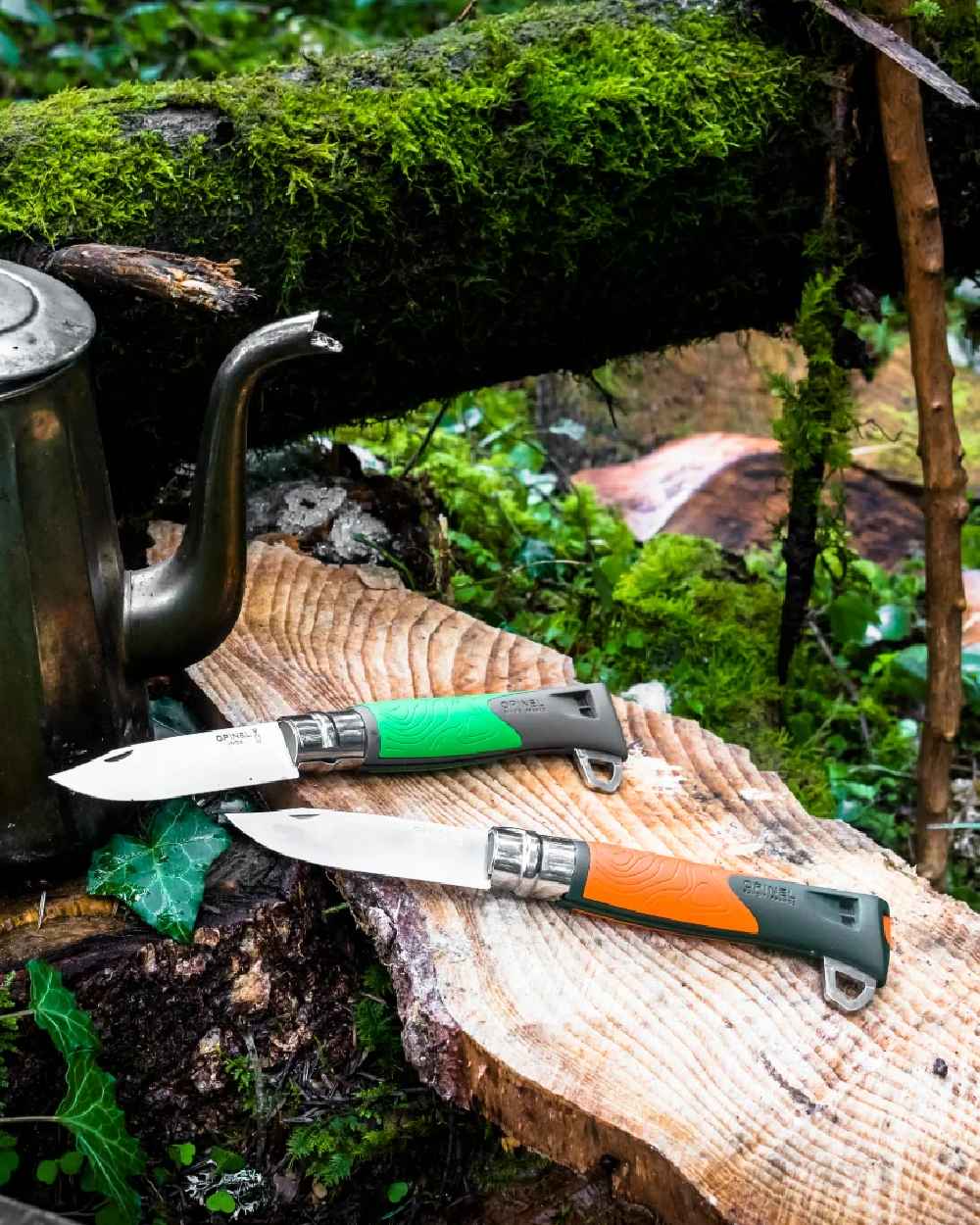 Orange Coloured Opinel No. 12 Explore Knife with Tick Remover On A forest Background