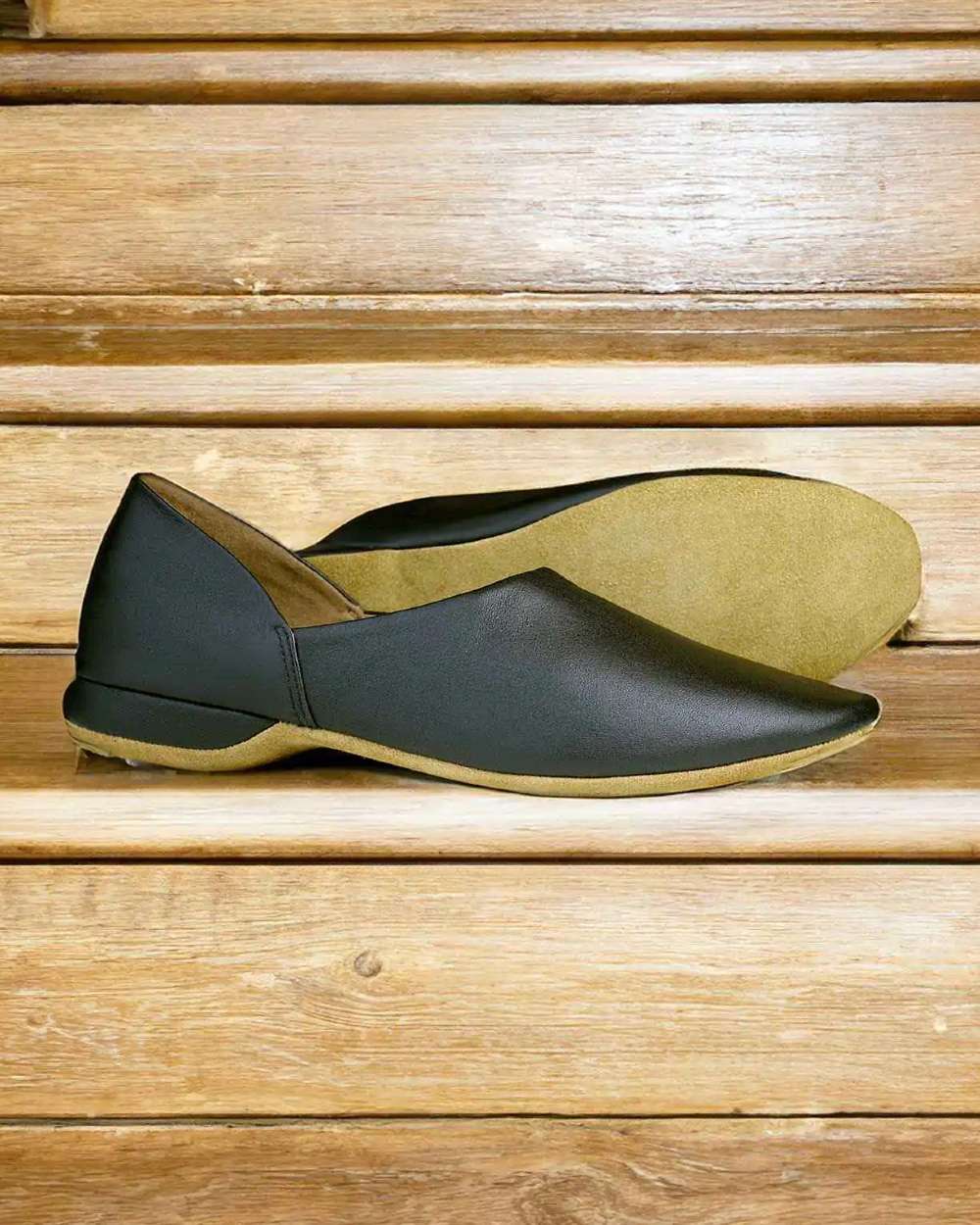 Black Coloured Orca Bay George Mens Slippers On Stairs Background