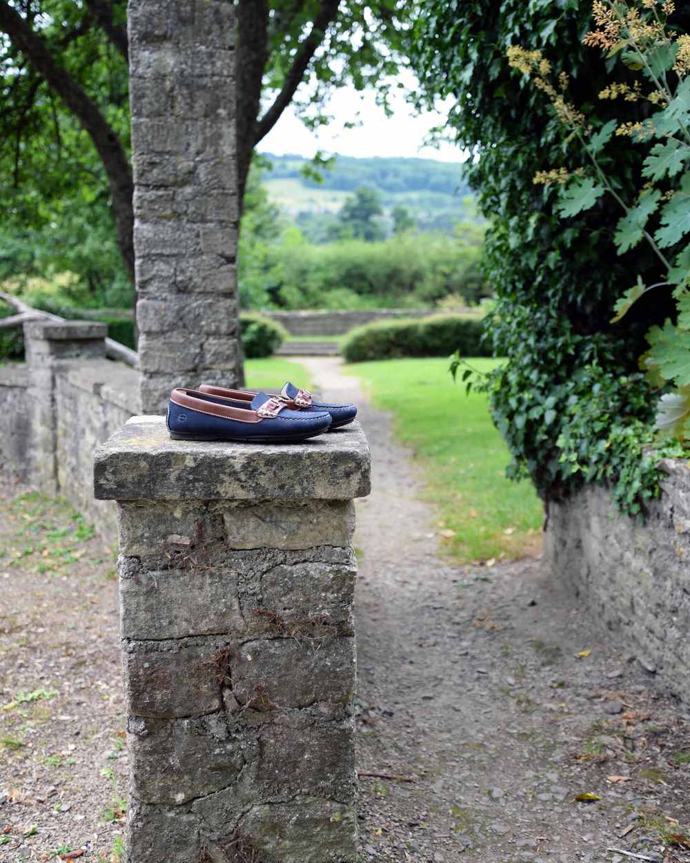 Navy Oak Coloured Orca Bay Verona Womens Loafers On A Garden Background
