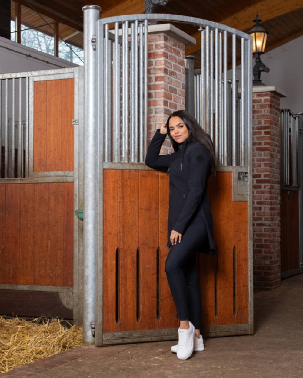 Black Coloured Pikeur Softshell Coat On A Stable Background