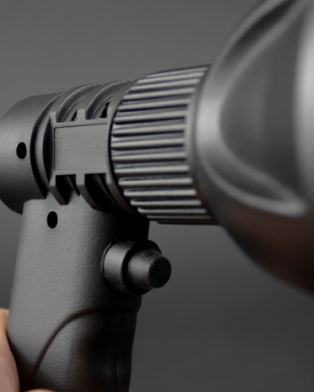 Black Coloured Richter Trigger Lamp On A Grey Background