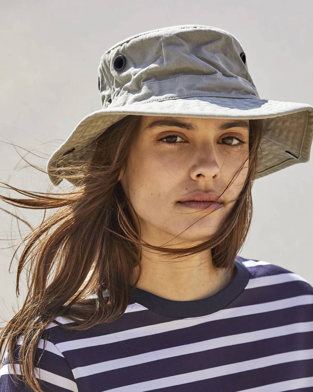 Khaki coloured Tilley T3 Wanderer Hat on dark grey background