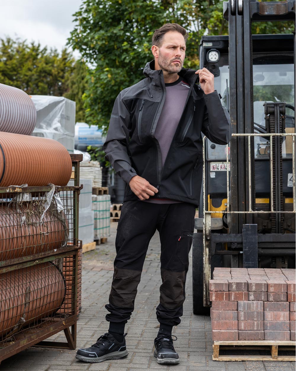 Black coloured TuffStuff ProShell Jacket on urban background