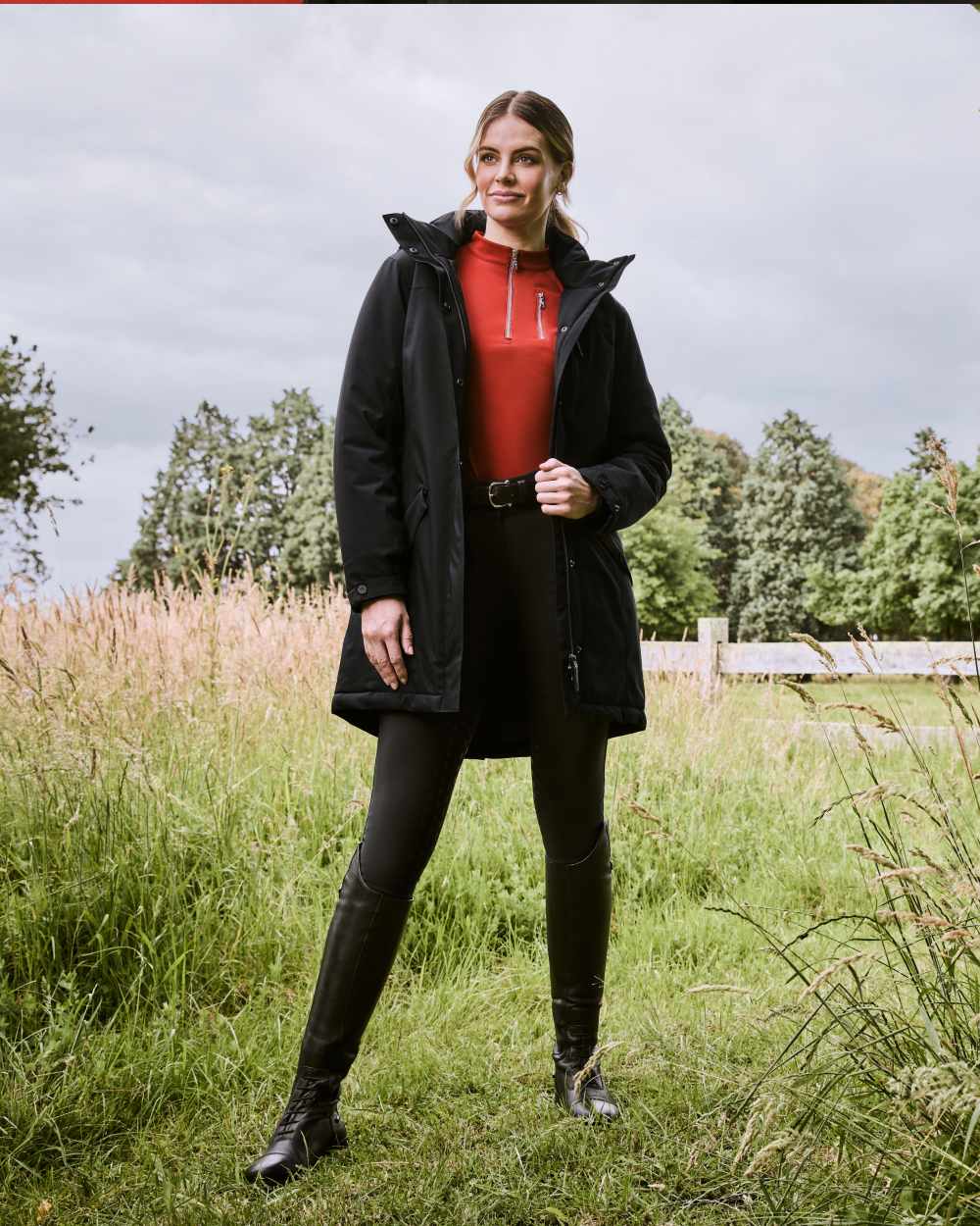 Black Coloured WeatherBeeta Kyla II Waterproof Jacket On A Stable Background