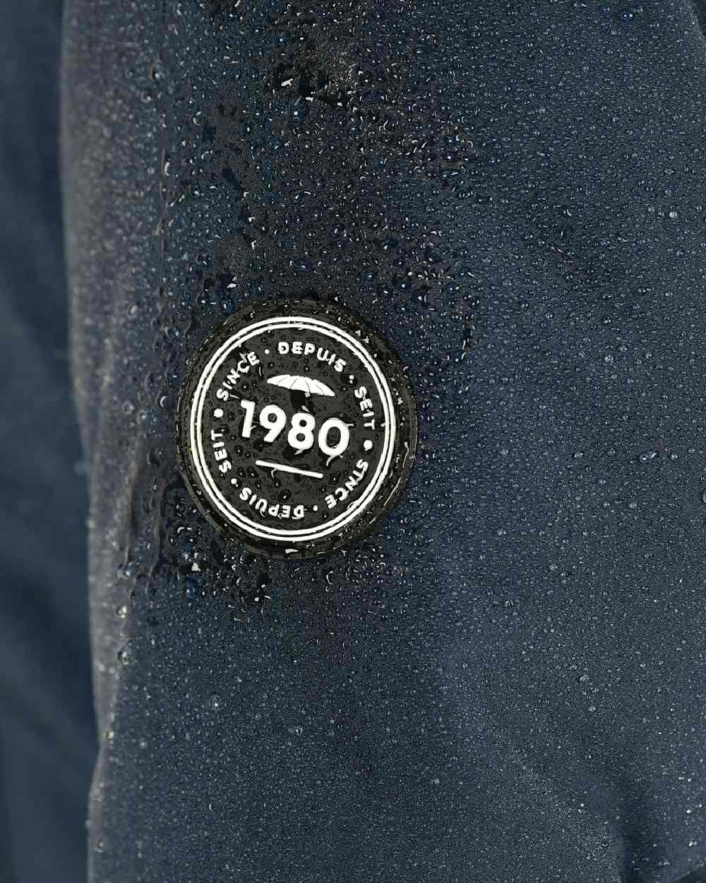 Navy Iris Coloured WeatherBeeta Kyla II Waterproof Jacket On A White Background