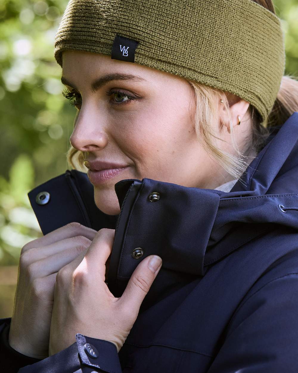 Navy Iris Coloured WeatherBeeta Kyla II Waterproof Jacket On A Forest Background