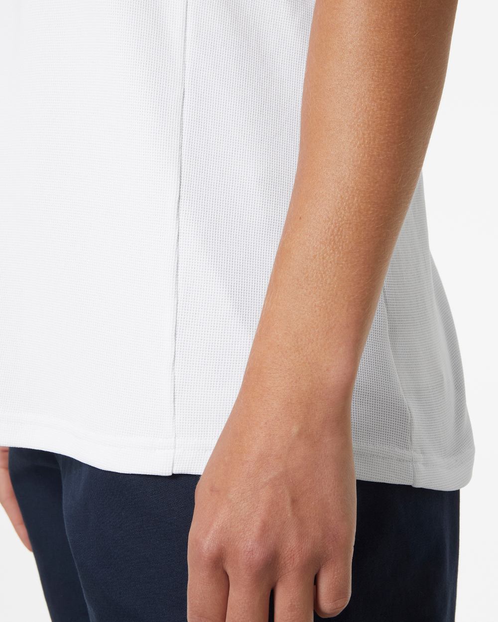 White coloured Helly Hansen womens crewline quick dry top on grey background