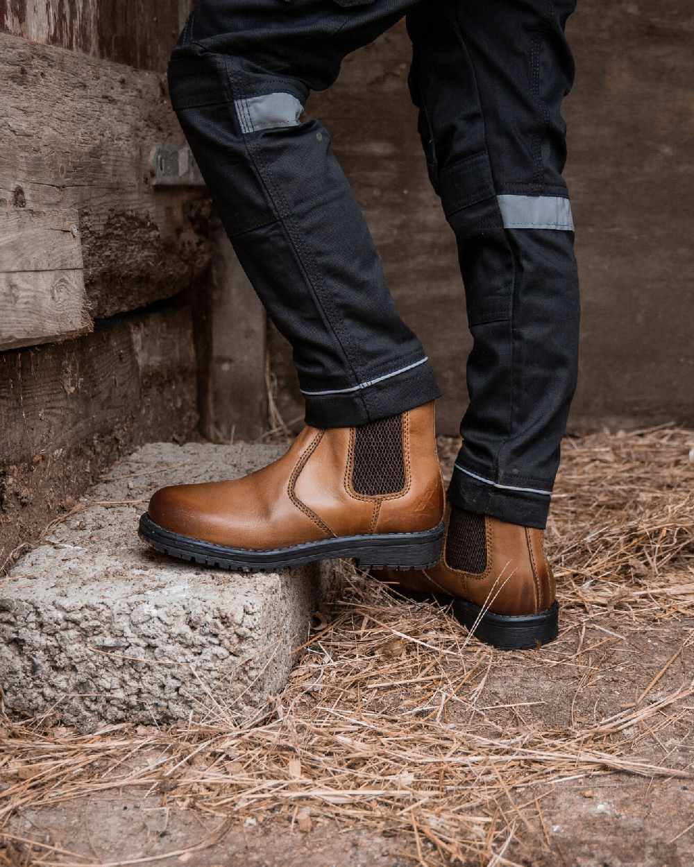 Burnished Brown Coloured Xpert Childrens Heritage Wrangler Dealer Boots on Outdoor Background