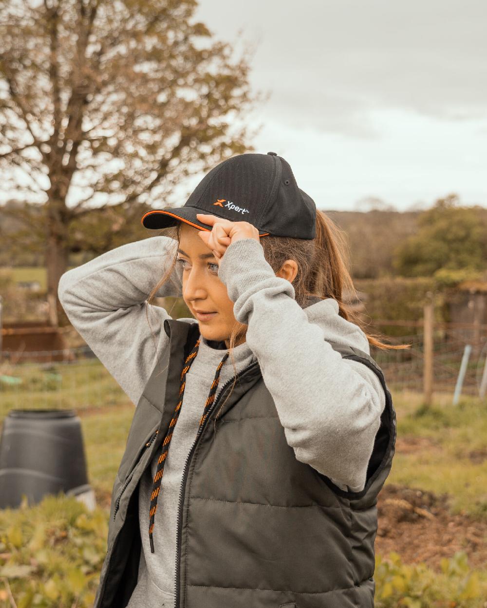 Black Coloured Xpert Core Baseball Cap on Outdoor Background