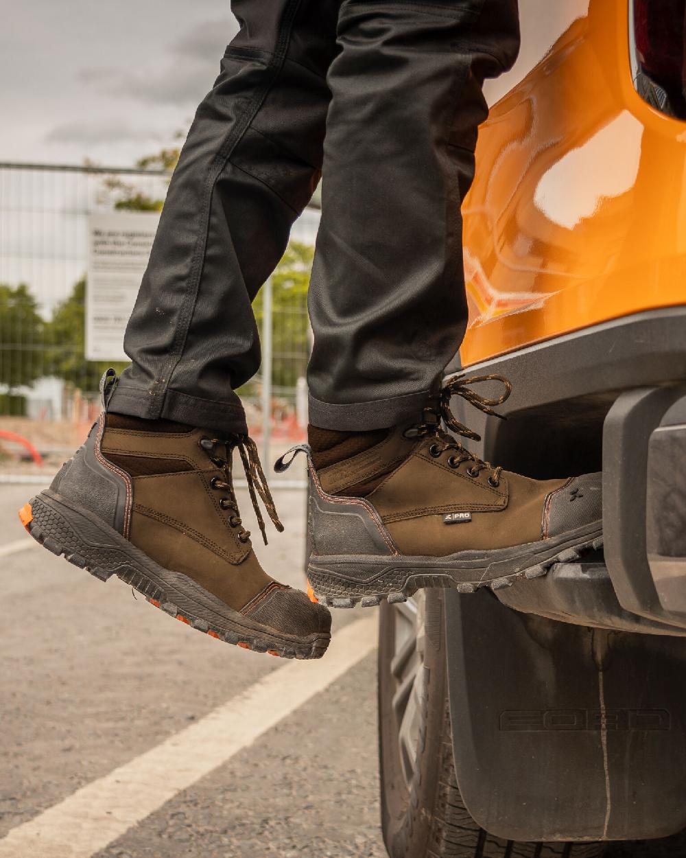 Brown Coloured Xpert Mens Pro Raptor Waterproof Safety Boots on Outdoor Background