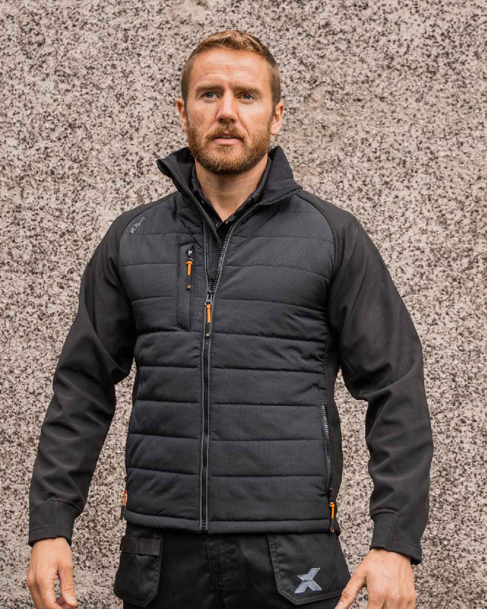 Black Coloured Xpert Mens Pro Rip-Stop Insulated Hybrid Jacket on Outdoor Background