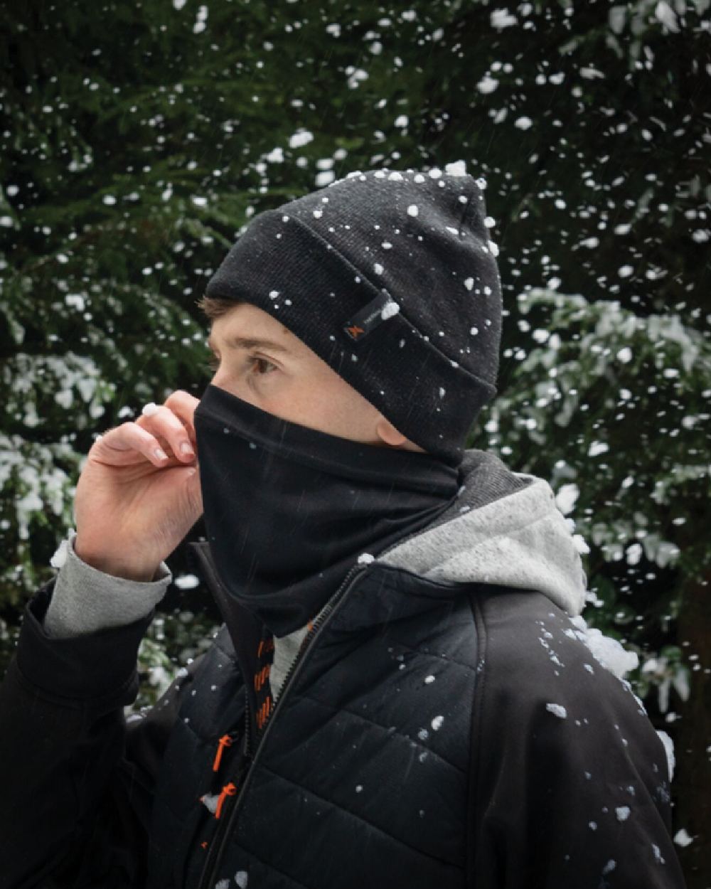 Black Coloured Xpert Winter Essentials Set Socks, Hat & Snood on Snow Background